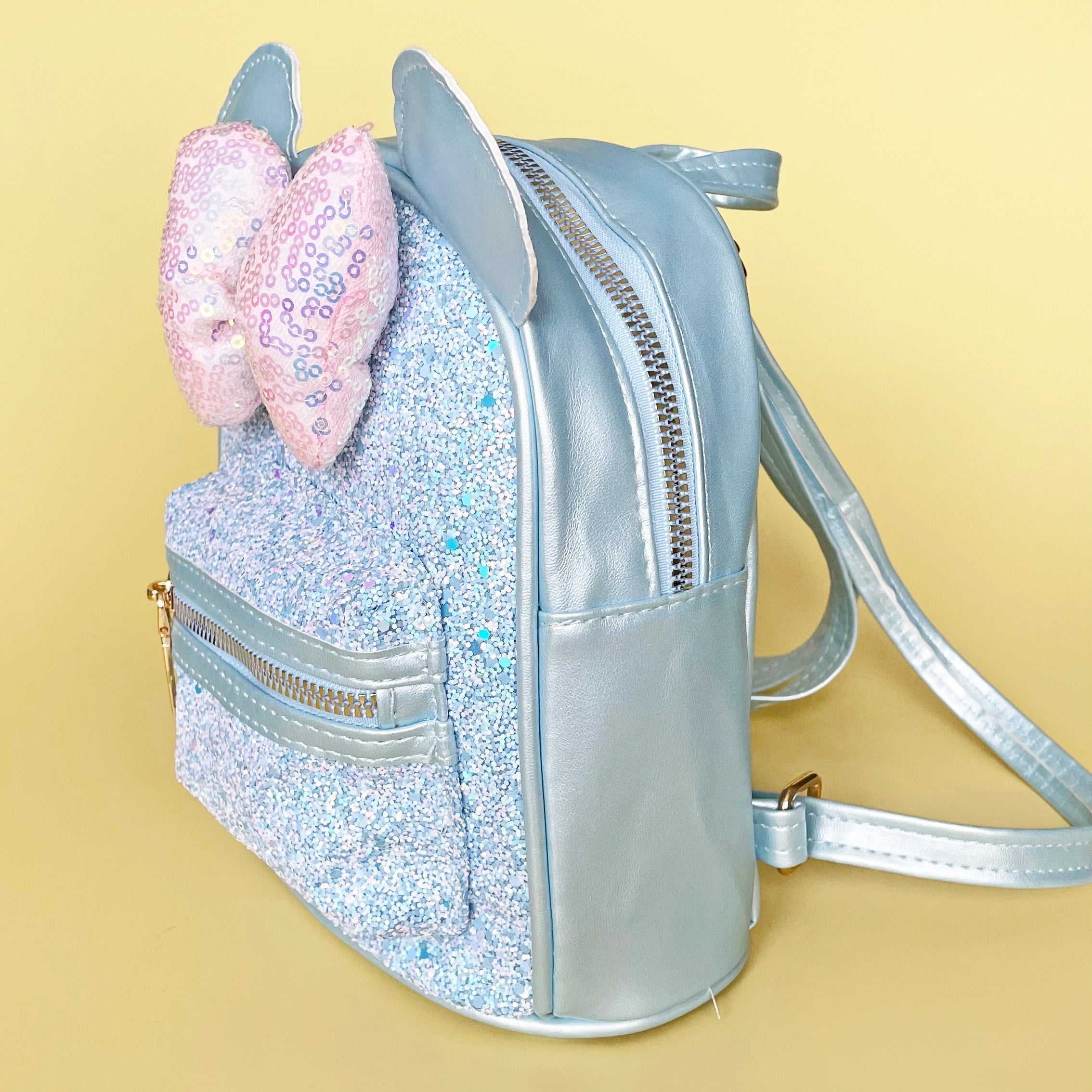 glitter fox mini backpack Dear Friends Features Polyurethane Applique and embroidered detailing Debossed and printed detailing PVC detailing Adjustable shoulder straps Coordinating interior lining Dimensions The Fox and the Hound